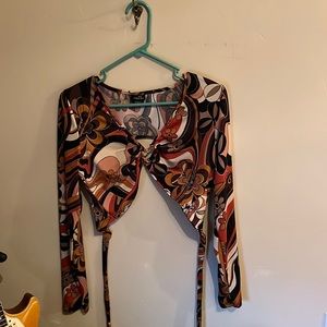 Brown, orange, and tan groovy crop top from Rue21. Size Large.
